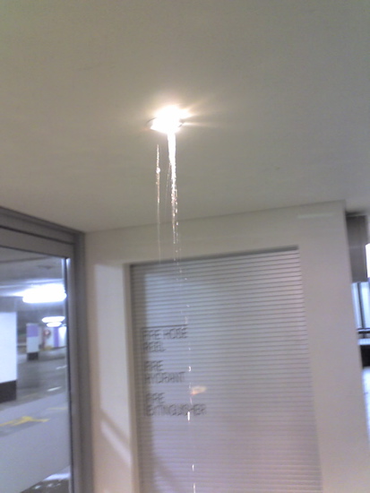 Rain falling through ceiling lights, Canberra Center, ACT, Australia